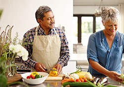 An older couple preparing healthy food to eat