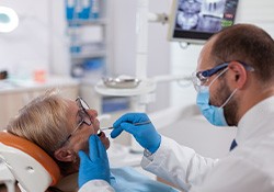 An older patient receiving a dental checkup