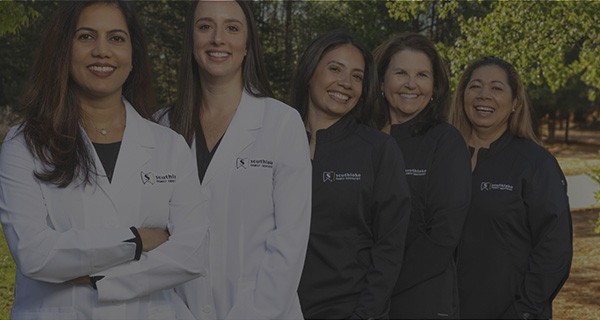 Southlake Family Dentistry team smiling outdoors in Fort Mill