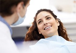 Female patient smiling in dental office 